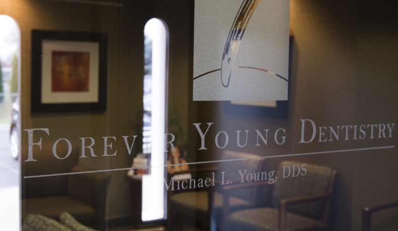 Forever Young Dentistry of Sterling Heights sign on entry door
