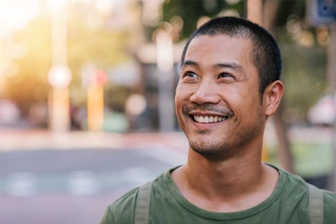 Man smiling outdoors