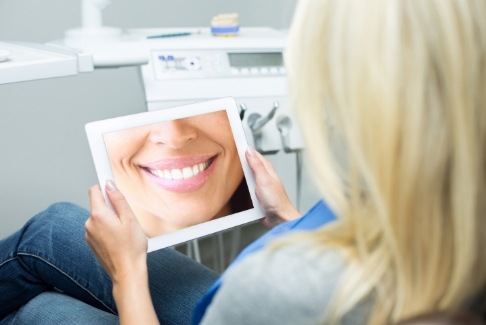 Woman looking at virtual smile design