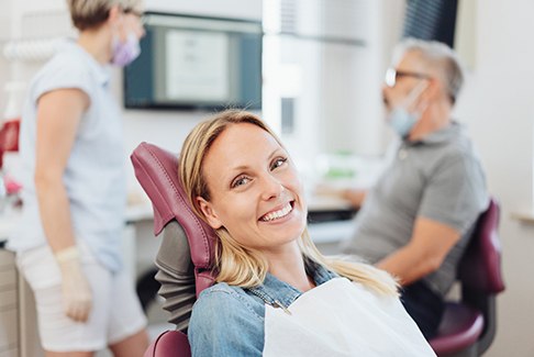 Woman smiling in the dental chair