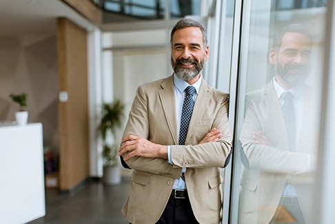 Man smiling in office building