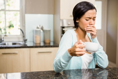 Woman in pain before wisdom tooth extractions