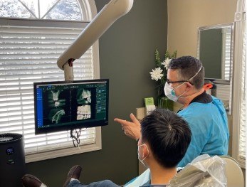 doctor with patient looking at x rays