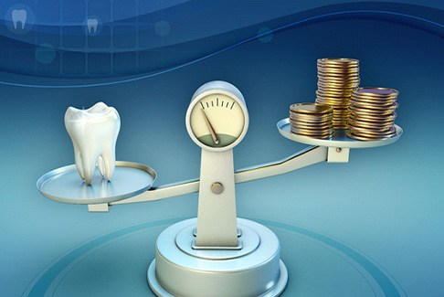 Tooth and coins on a balance scale