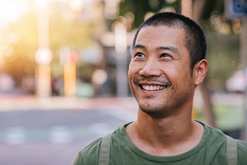 Man smiling outside