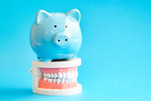 woman thinking about cost of dental implants in Sterling Heights