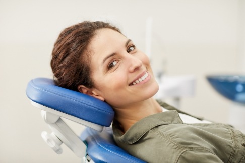 Woman smiling in dental treatment chair