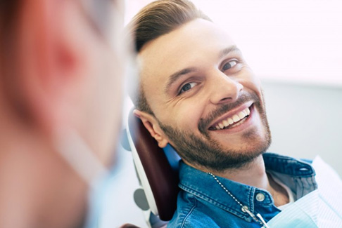 a patient smiling during his dental visit