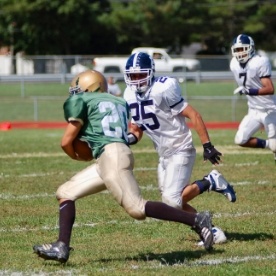 Teens playing football