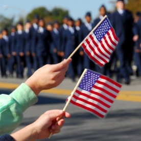 People holding up American flags