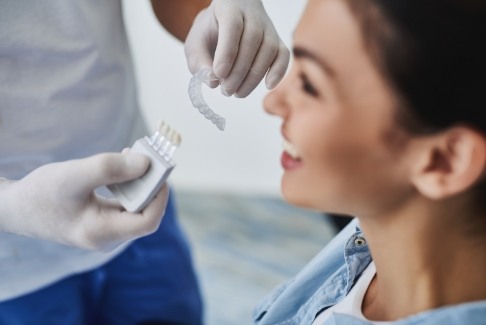 Dentist explaining Invisalign clear braces orthodontics treatment