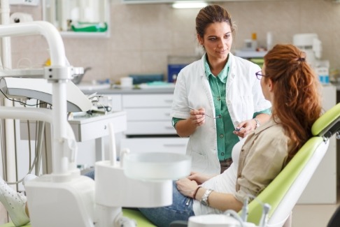 Dentist and dental patient discussing wisdom tooth extractions
