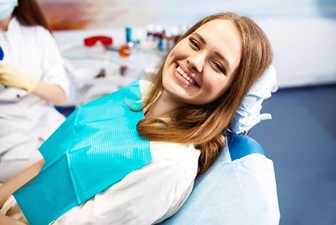 a patient smiling after undergoing root canal treatment
