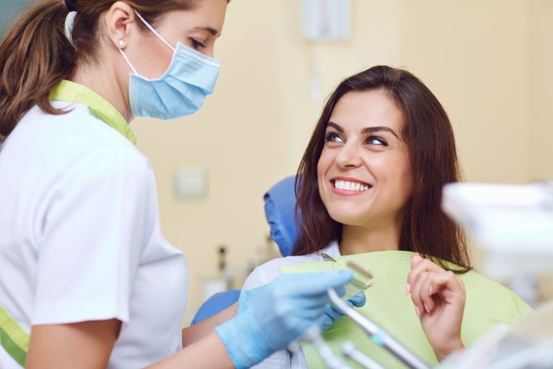 Patient smiling at dentist after root canal